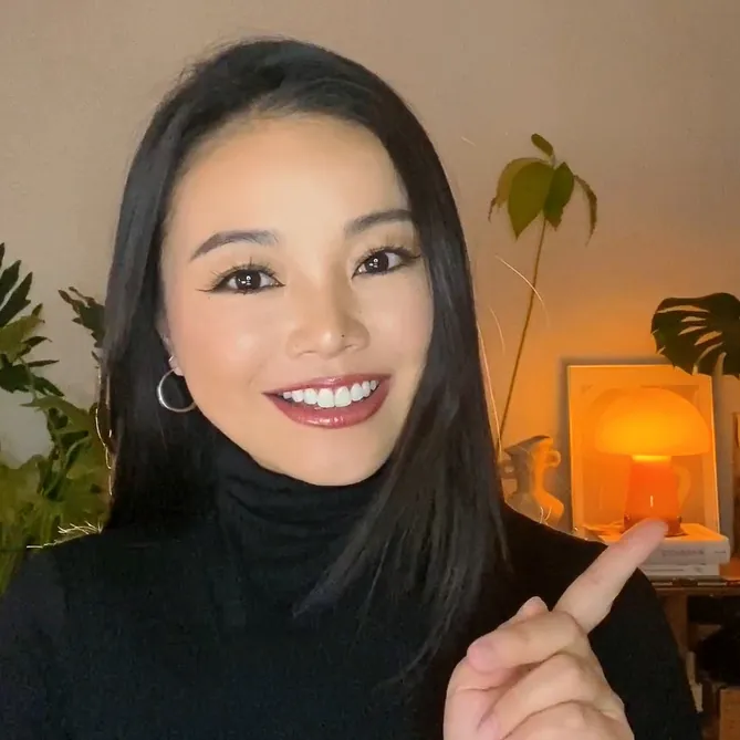 Cristina smiling and pointing